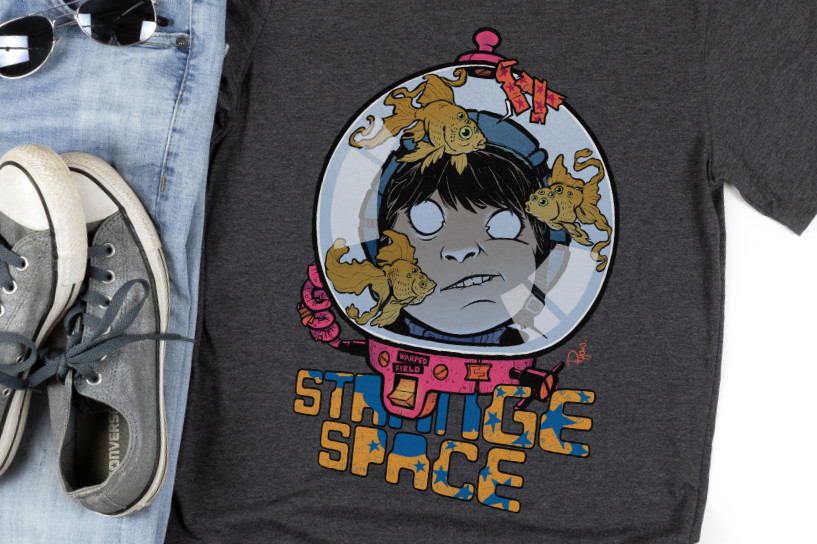 Shirt mockup with an illustration of an astronaut in a space helmet and alien goldfish over the words "Strange Space".
